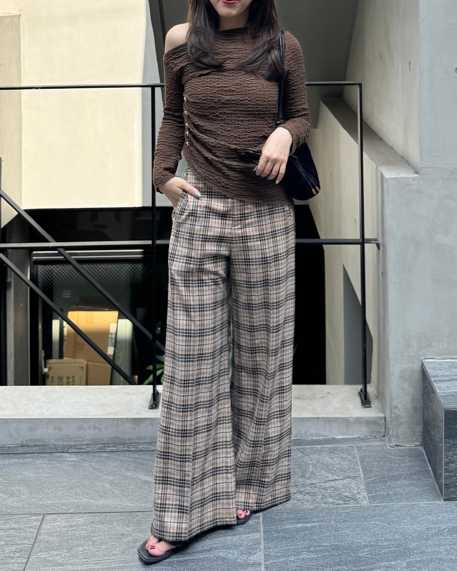 Asymmetrical gold button tops