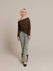 Asymmetrical gold button tops