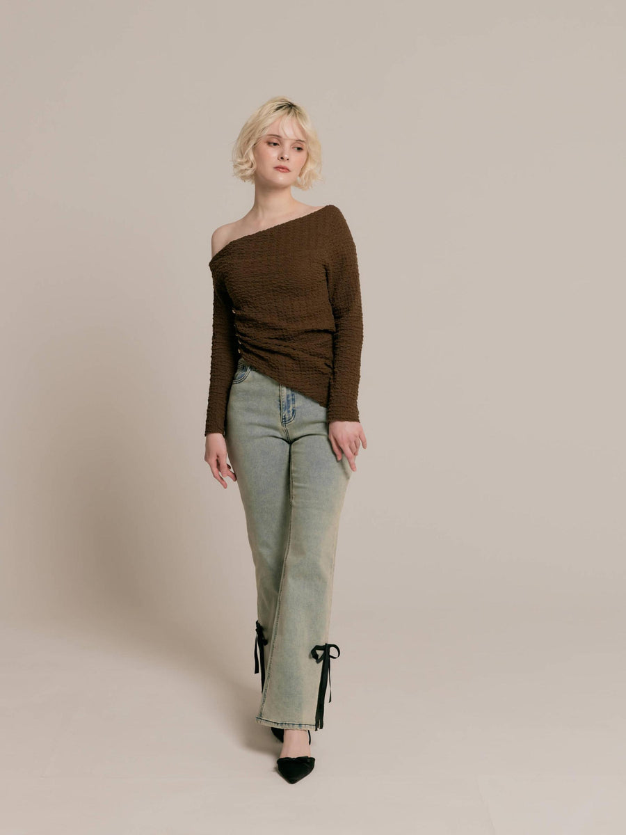 Asymmetrical gold button tops