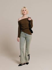 Asymmetrical gold button tops