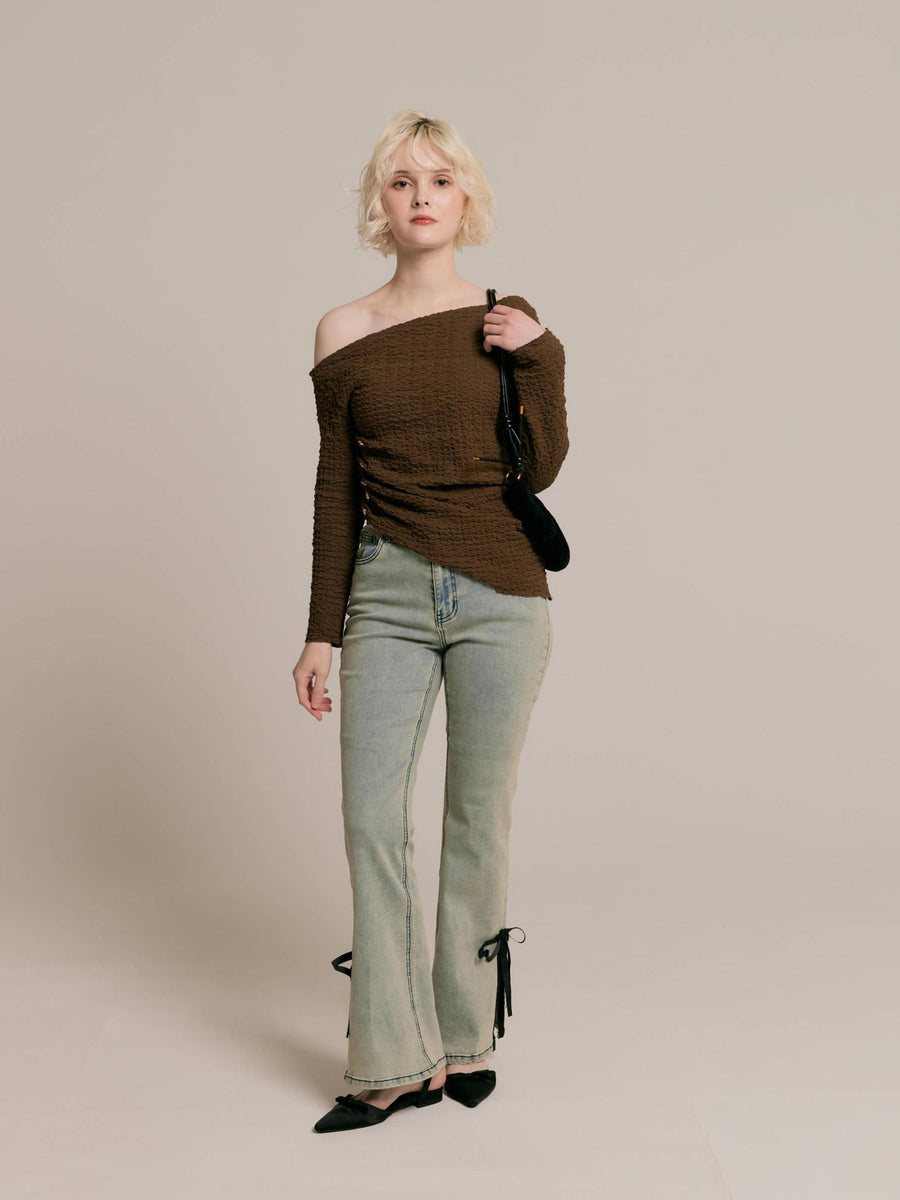 Asymmetrical gold button tops