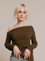 Asymmetrical gold button tops