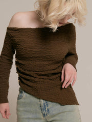 Asymmetrical gold button tops