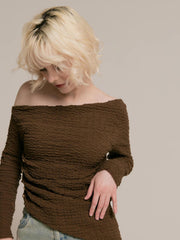 Asymmetrical gold button tops