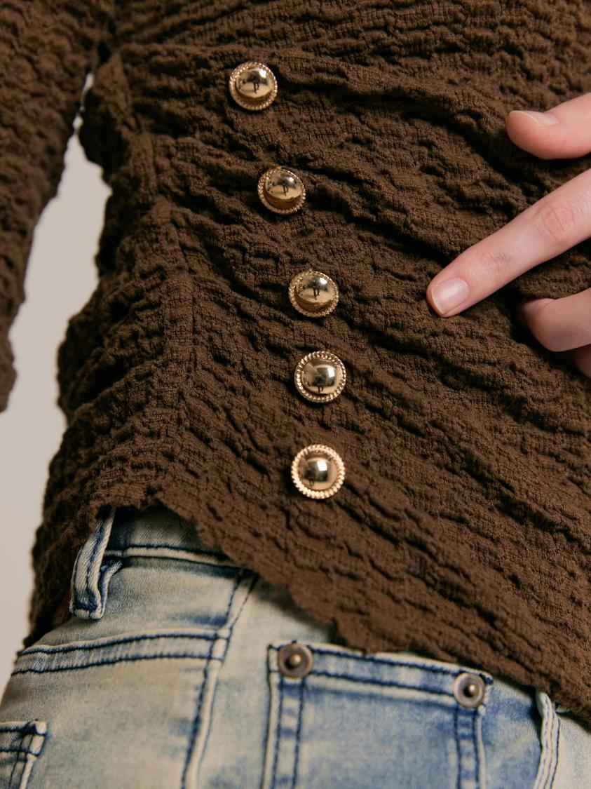 Asymmetrical gold button tops