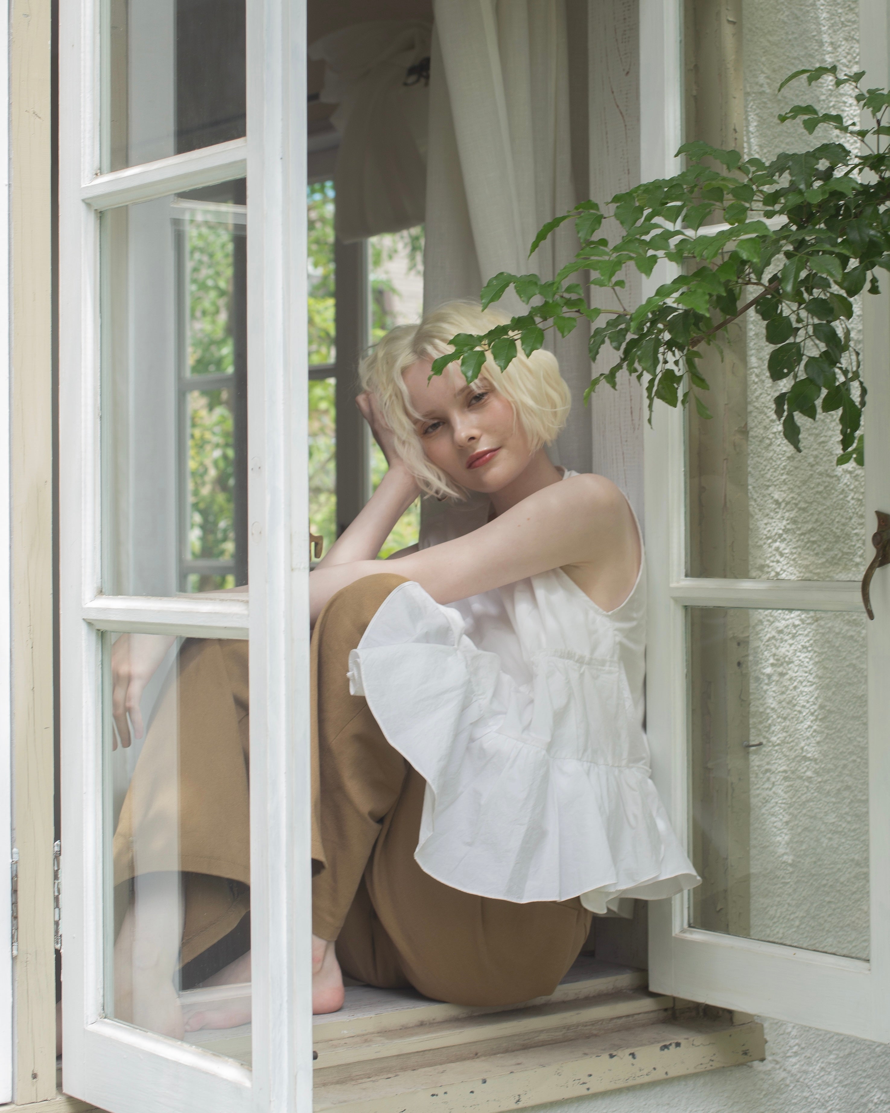 【残りわずか】Ruffled peplum blouse