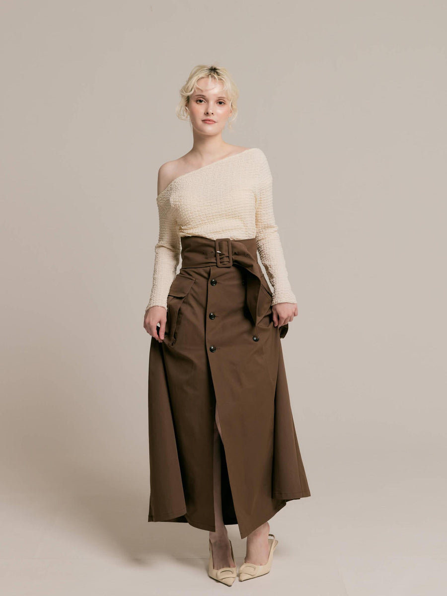 Asymmetrical gold button tops