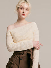 Asymmetrical gold button tops