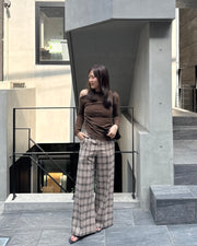 Asymmetrical gold button tops