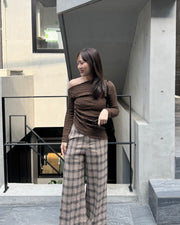 Asymmetrical gold button tops