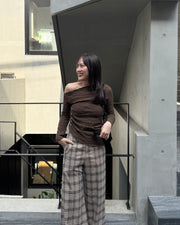 Asymmetrical gold button tops