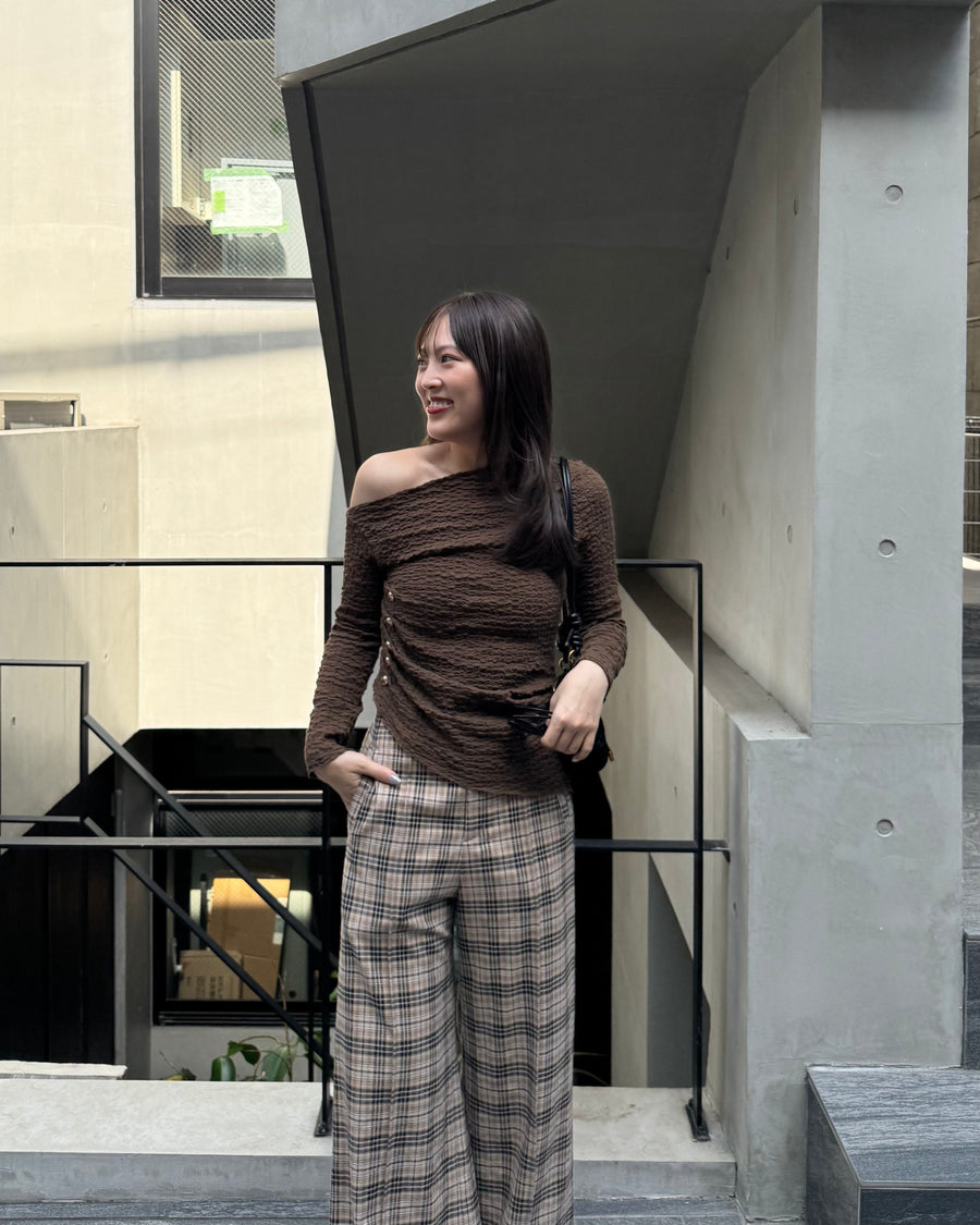 Asymmetrical gold button tops