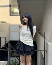 Asymmetrical gold button tops