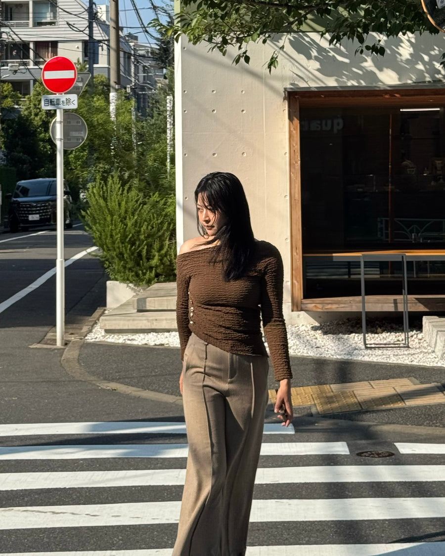 Asymmetrical gold button tops