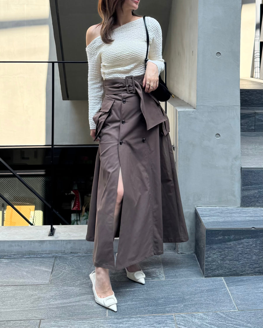 Asymmetrical gold button tops