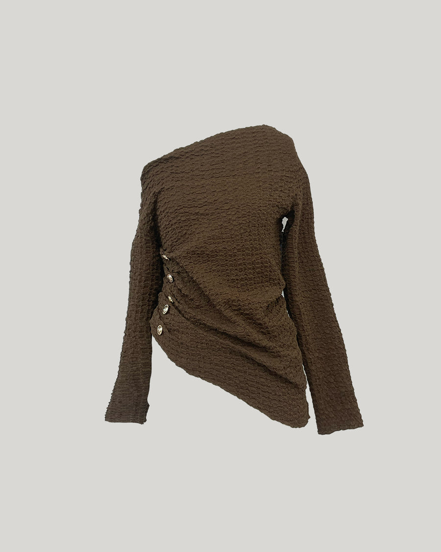 Asymmetrical gold button tops