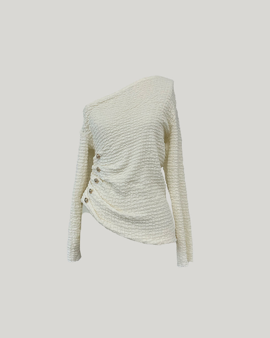 Asymmetrical gold button tops