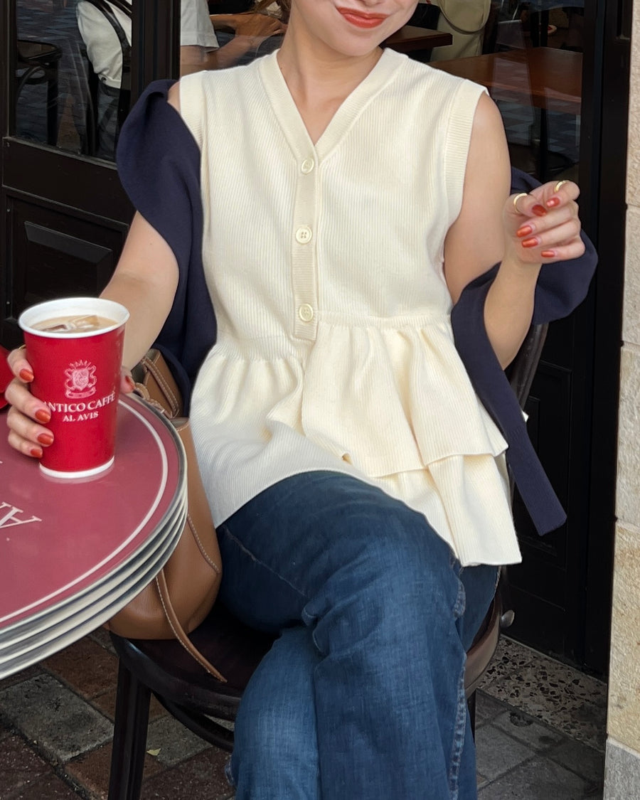 Asymmetric peplum vest