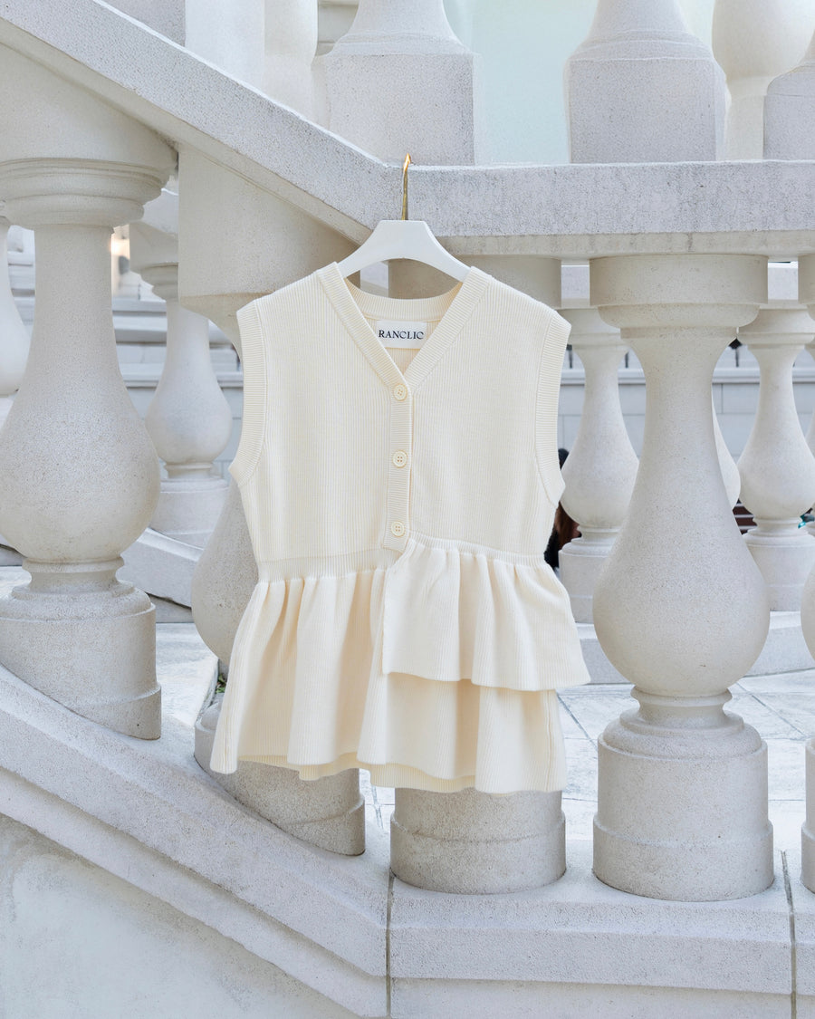 Asymmetric peplum vest