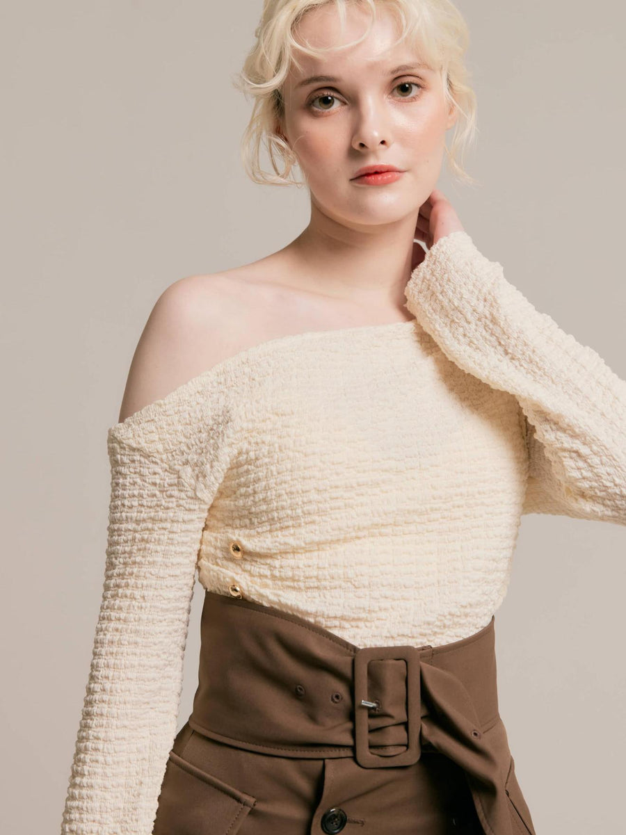 Asymmetrical gold button tops