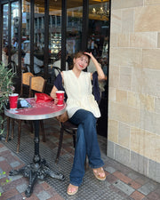 Asymmetric peplum vest