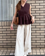 Asymmetric peplum vest