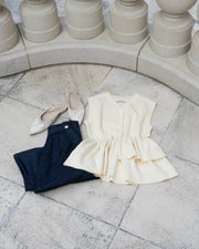 Asymmetric peplum vest