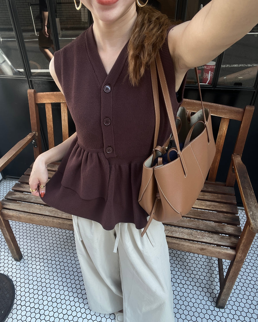 Asymmetric peplum vest