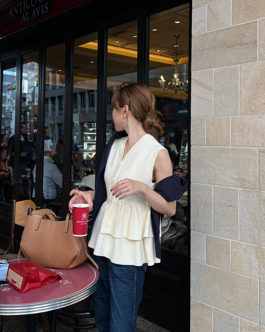 Asymmetric peplum vest