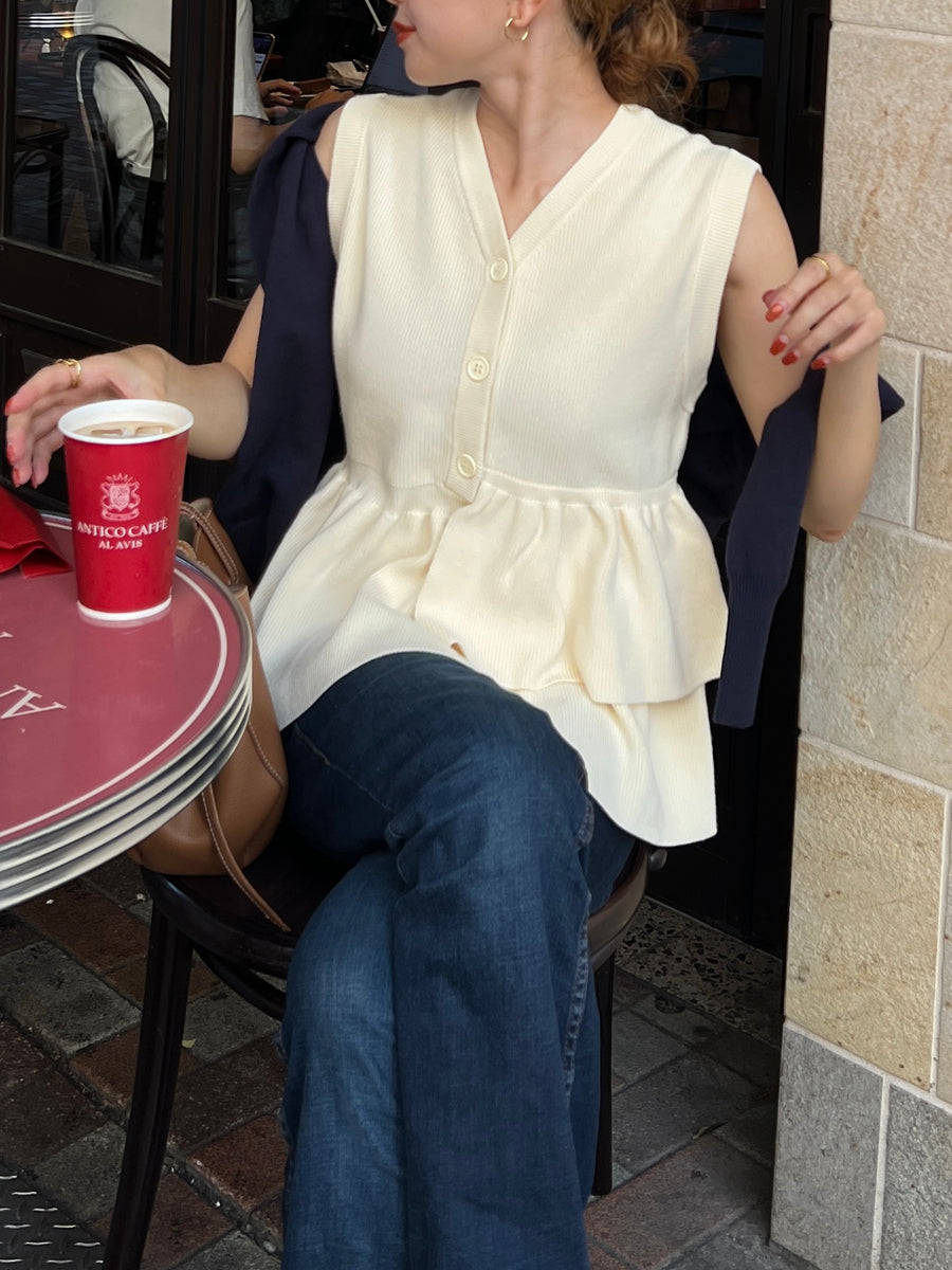 Asymmetric peplum vest