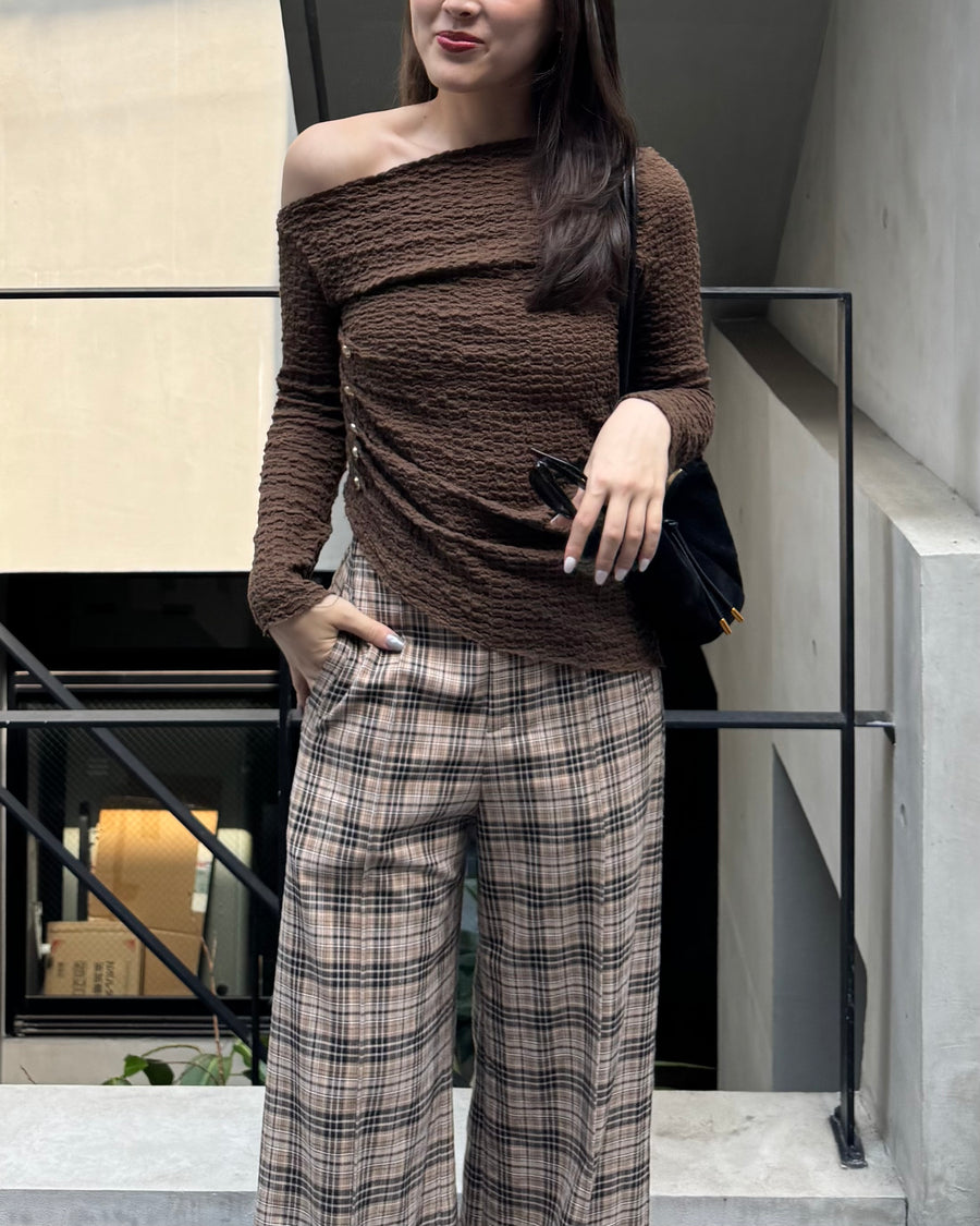 Asymmetrical gold button tops