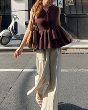 Asymmetric peplum vest