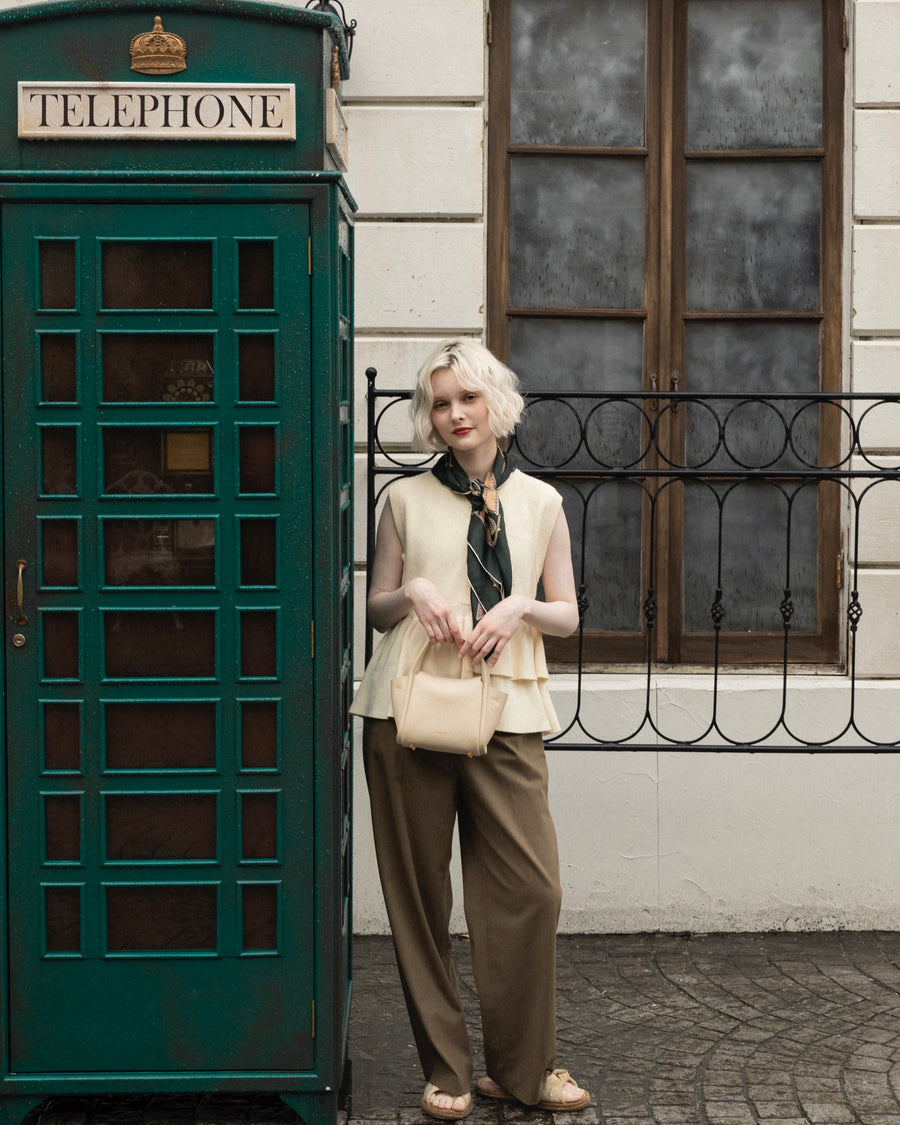 Asymmetric peplum vest