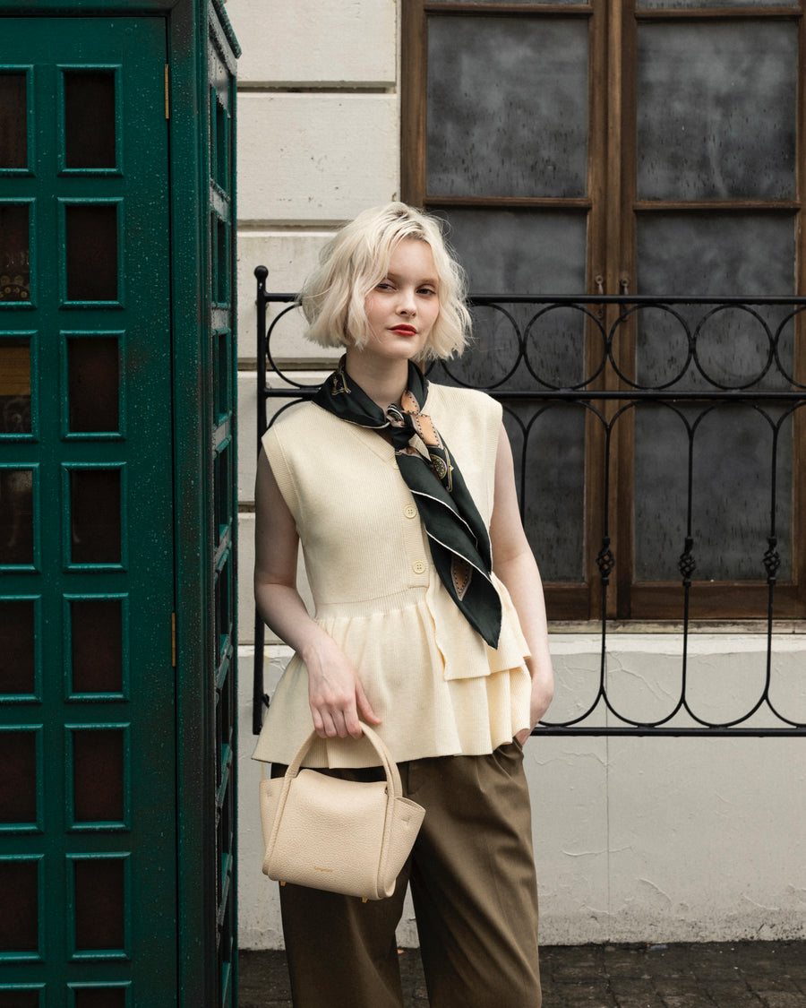 Asymmetric peplum vest