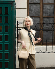 Asymmetric peplum vest
