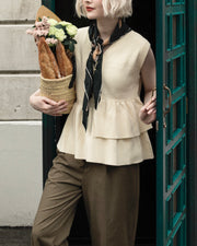 Asymmetric peplum vest